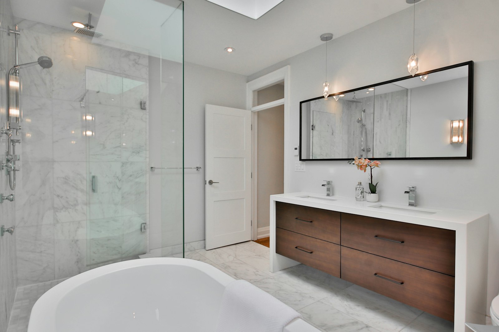 Simulated “before” look of the same photo: bathroom with a floating double vanity and walk-in shower