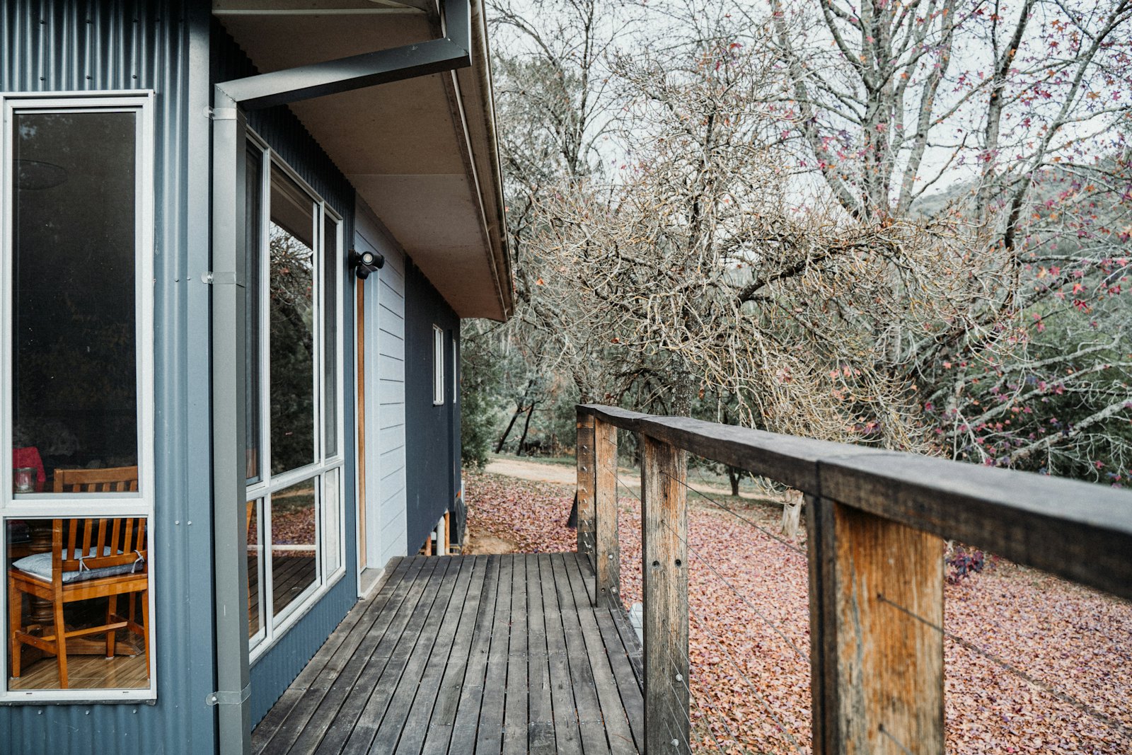 Wooden deck along the side of a house