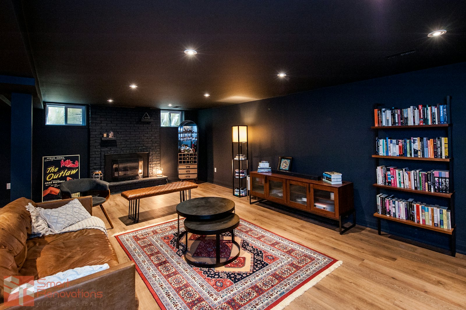 Cosy basement family room with bookshelves and a rug
